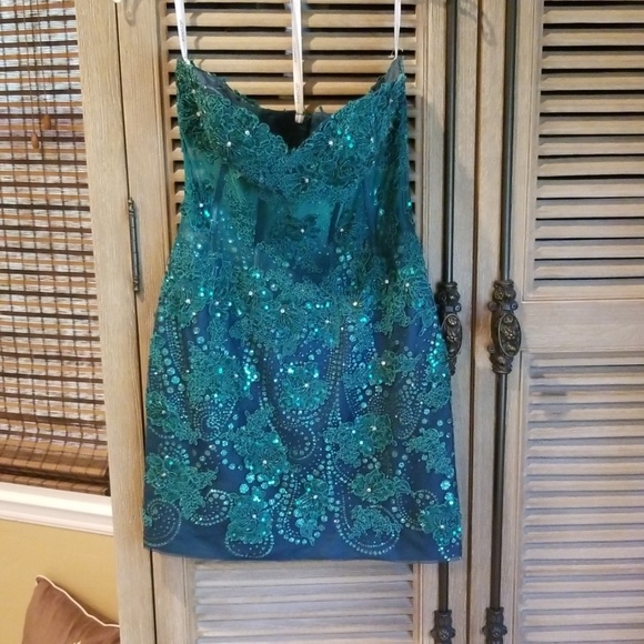 Jovani Dresses & Skirts - Jovani strapless minidress with bodice and sequins